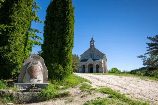 Scallop shell and Saint-Roch Chapel on the Way of St. James