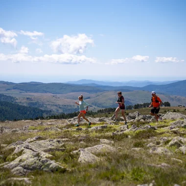 Trail runners at the summit of Finiels