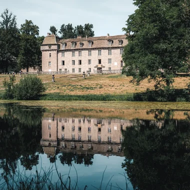 Château de la Baume reflected in the pond