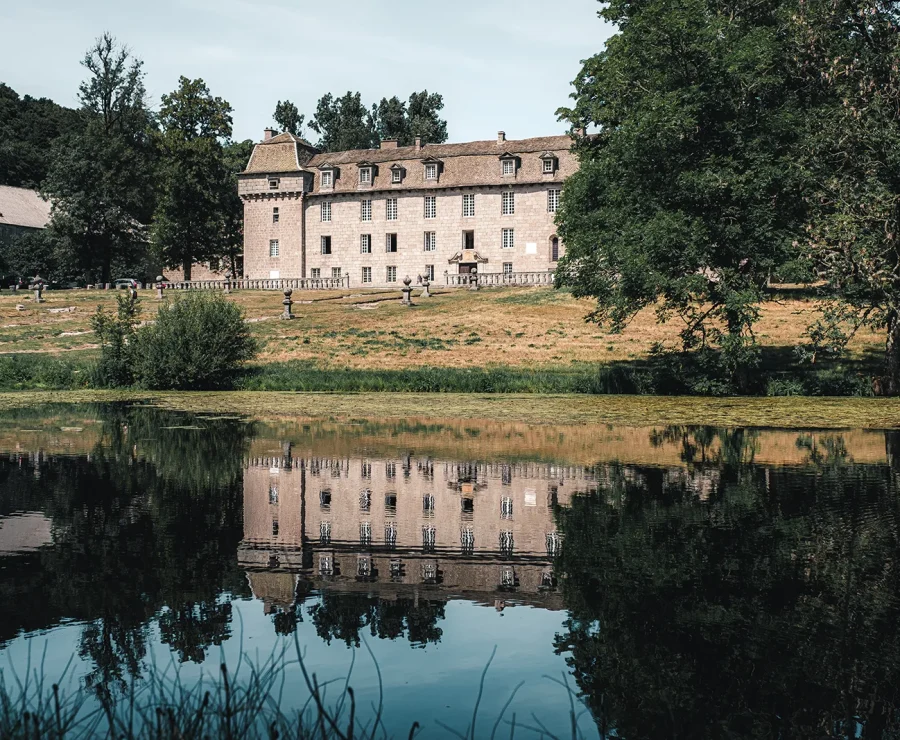 Château de la Baume reflected in the pond